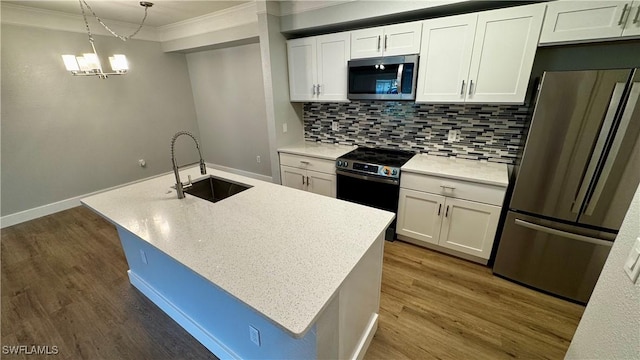 11530 Villa Grand Unit 1101, Fort Myers, FL 33913 - kitchen featuring stainless steel appliances, crown molding, white cabinets, decorative backsplash, and dark wood-type flooring