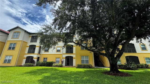 11530 Villa Grand Unit 1101, Fort Myers, FL 33913 - view of property with a front yard and stairway