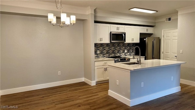 11530 Villa Grand Unit 1101, Fort Myers, FL 33913 - kitchen with stainless steel appliances, backsplash, a chandelier, dark wood finished floors, and crown molding
