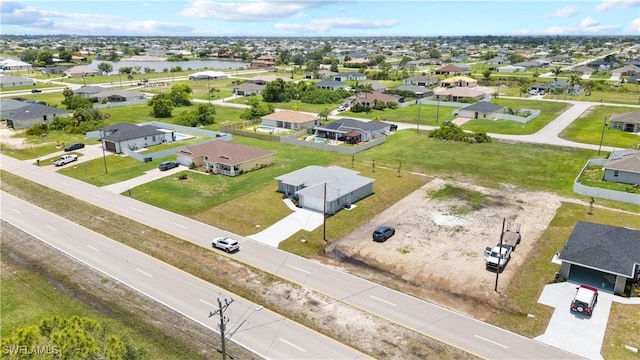 1702 Nelson Rd N, Cape Coral, FL 33993 - aerial view of residential area with a nearby body of water