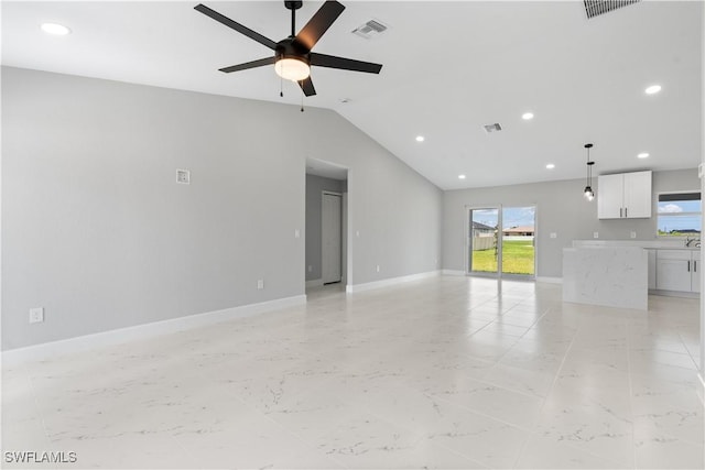 1702 Nelson Rd N, Cape Coral, FL 33993 - unfurnished living room featuring a ceiling fan, vaulted ceiling, recessed lighting, and light marble finish floors