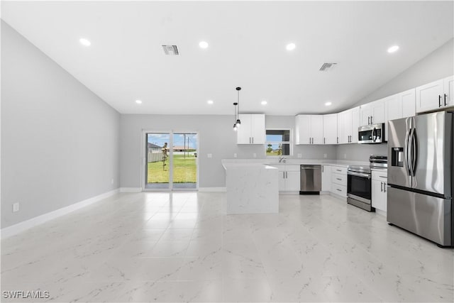 1702 Nelson Rd N, Cape Coral, FL 33993 - kitchen featuring appliances with stainless steel finishes, light countertops, recessed lighting, white cabinets, and pendant lighting