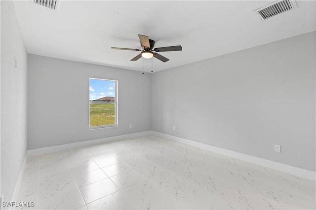 1710 Nelson Rd N, Cape Coral, FL 33993 - unfurnished room with marble finish flooring and a ceiling fan