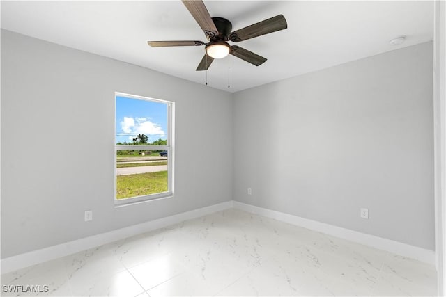 1710 Nelson Rd N, Cape Coral, FL 33993 - unfurnished room featuring light marble finish floors and ceiling fan