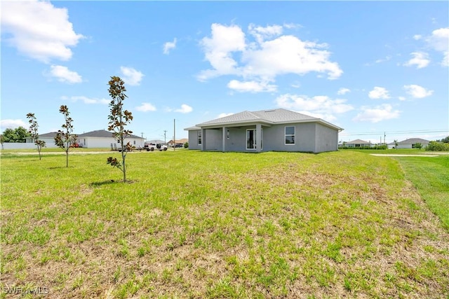1710 Nelson Rd N, Cape Coral, FL 33993 - view of grassy yard
