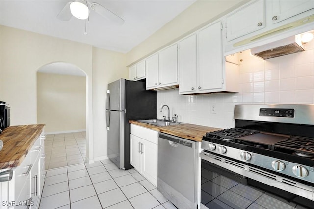 527 Goodland Drive W, Goodland, FL 34140 - kitchen featuring appliances with stainless steel finishes, butcher block countertops, under cabinet range hood, arched walkways, and ceiling fan