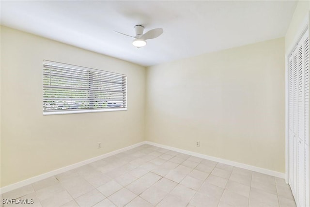 527 Goodland Drive W, Goodland, FL 34140 - unfurnished bedroom with a ceiling fan, a closet, and light tile patterned flooring