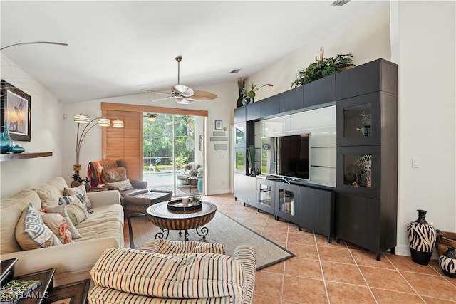 1381 Areca Cv, Naples, FL 34119 - living area featuring light tile patterned flooring, vaulted ceiling, and ceiling fan