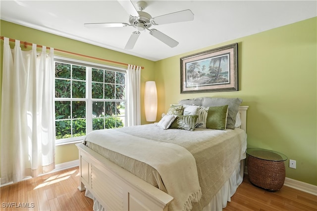 1381 Areca Cv, Naples, FL 34119 - bedroom featuring light wood finished floors and a ceiling fan