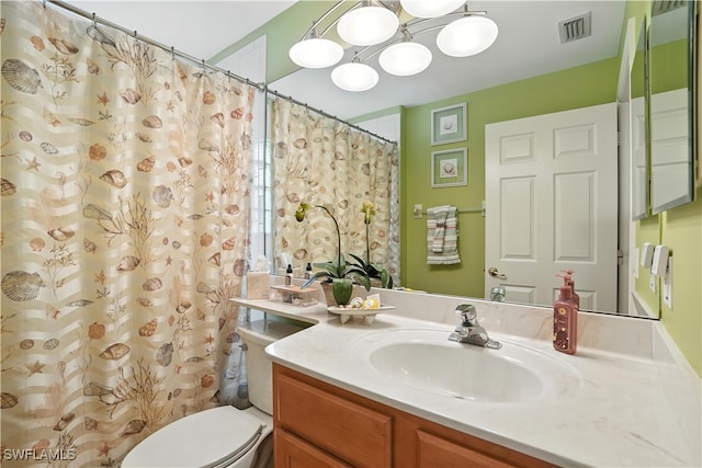 1381 Areca Cv, Naples, FL 34119 - full bathroom featuring vanity, curtained shower, and a chandelier