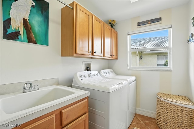 1381 Areca Cv, Naples, FL 34119 - laundry room with cabinet space, washing machine and dryer, and light tile patterned floors