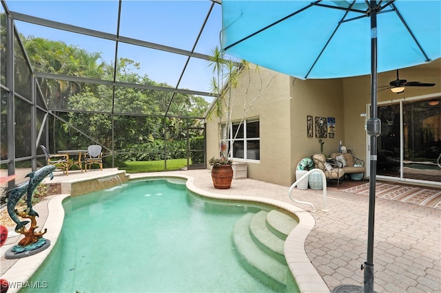 1381 Areca Cv, Naples, FL 34119 - outdoor pool featuring a patio area, glass enclosure, and a ceiling fan