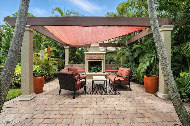 1381 Areca Cv, Naples, FL 34119 - view of patio / terrace featuring an outdoor living space with a fireplace