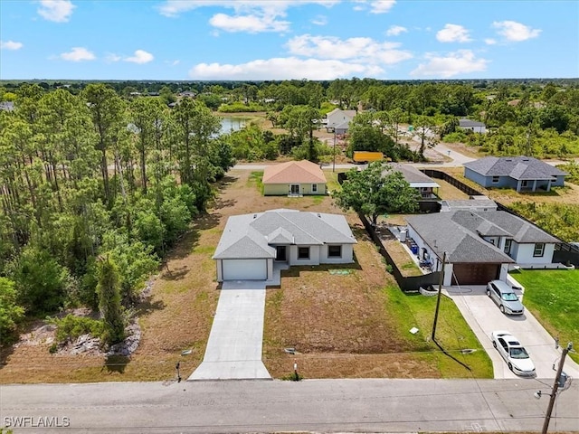aerial perspective of suburban area with a large body of water