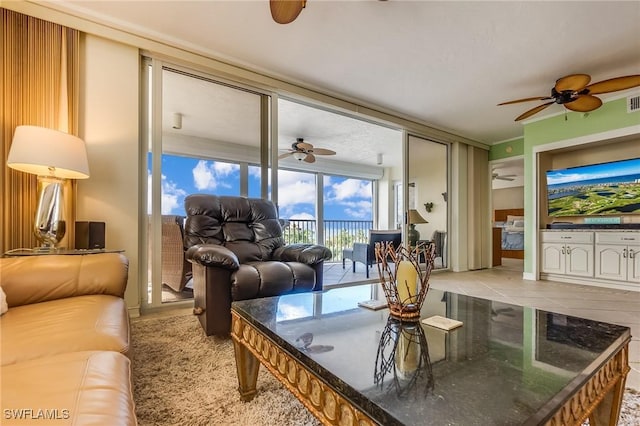 4745 Estero Blvd Unit 302, Fort Myers Beach, FL 33931 - living area with ceiling fan and light tile patterned floors