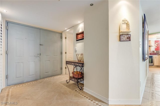 4745 Estero Blvd Unit 302, Fort Myers Beach, FL 33931 - entryway featuring light tile patterned flooring, recessed lighting, and inlaid floor details
