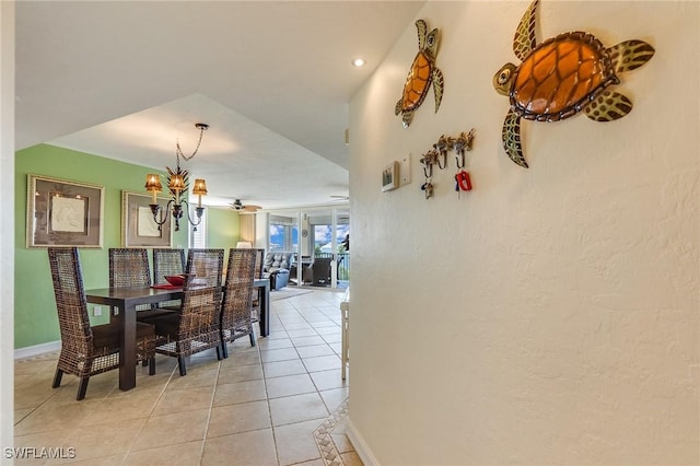 4745 Estero Blvd Unit 302, Fort Myers Beach, FL 33931 - dining space featuring light tile patterned floors and a chandelier