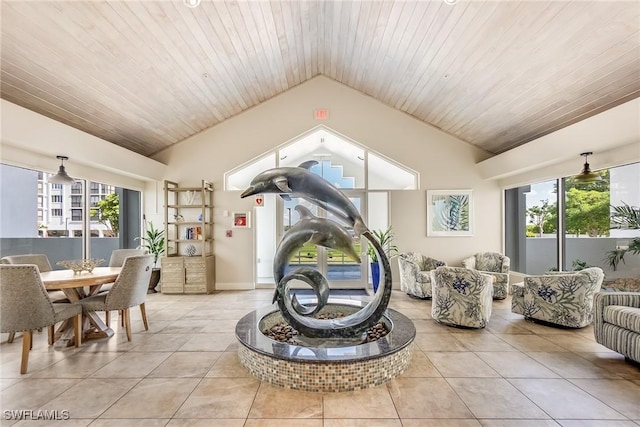4745 Estero Blvd Unit 302, Fort Myers Beach, FL 33931 - living area with vaulted ceiling, light tile patterned floors, healthy amount of natural light, and wood ceiling