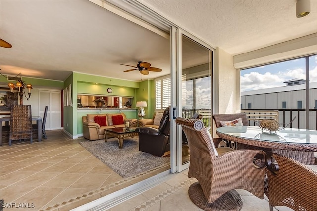 4745 Estero Blvd Unit 302, Fort Myers Beach, FL 33931 - living room with light tile patterned floors, a ceiling fan, and a chandelier
