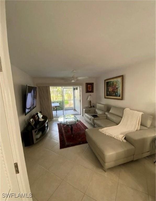 850 Elkhorn Ct Unit 213, Marco Island, FL 34145 - living area with light tile patterned flooring and ceiling fan