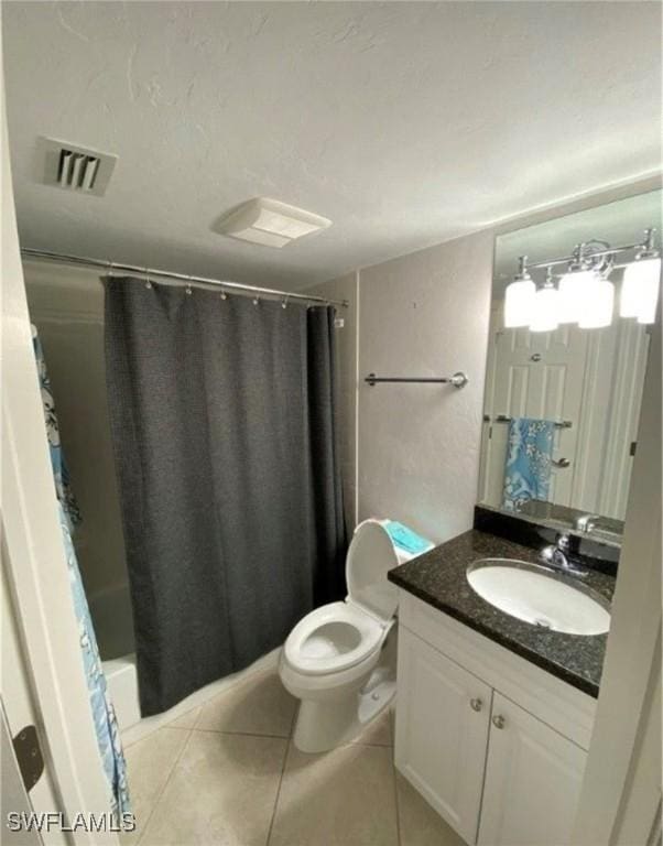 850 Elkhorn Ct Unit 213, Marco Island, FL 34145 - bathroom with vanity, tile patterned floors, and shower / bath combo with shower curtain