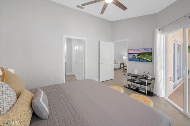 3505 Avion Woods Ct Unit 902, Naples, FL 34104 - bedroom with light wood-type flooring and a ceiling fan