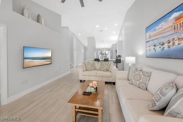 3505 Avion Woods Ct Unit 902, Naples, FL 34104 - living area featuring light wood finished floors, a ceiling fan, and recessed lighting