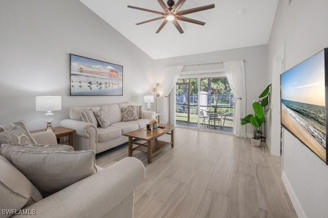 3505 Avion Woods Ct Unit 902, Naples, FL 34104 - living area featuring a ceiling fan, light wood-type flooring, and high vaulted ceiling