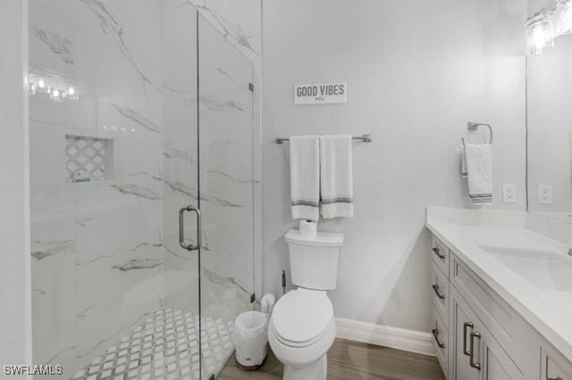 3505 Avion Woods Ct Unit 902, Naples, FL 34104 - full bath featuring vanity, a marble finish shower, and wood finished floors