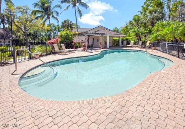 3505 Avion Woods Ct Unit 902, Naples, FL 34104 - community pool featuring a patio area