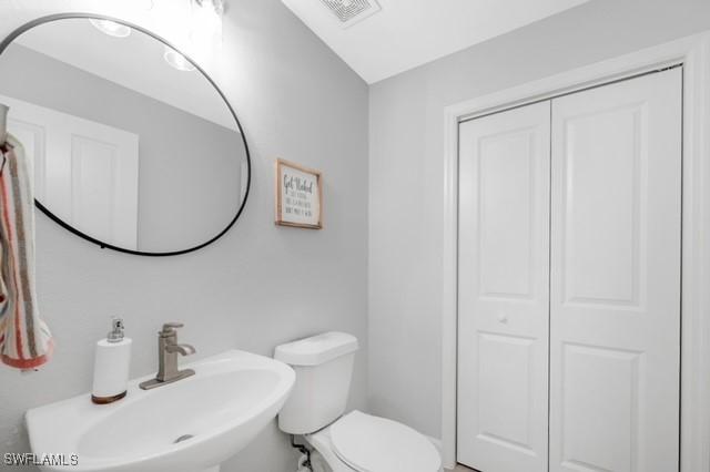 3505 Avion Woods Ct Unit 902, Naples, FL 34104 - half bath with a sink and toilet