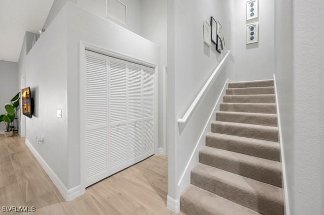 3505 Avion Woods Ct Unit 902, Naples, FL 34104 - staircase featuring wood finished floors