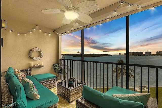 400 Lenell Rd Unit 207, Fort Myers Beach, FL 33931 - balcony featuring an outdoor hangout area, a water view, and a ceiling fan