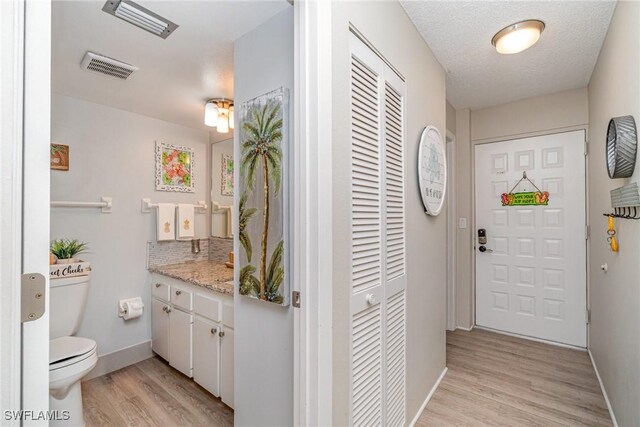 400 Lenell Rd Unit 207, Fort Myers Beach, FL 33931 - foyer entrance featuring light wood-style flooring and baseboards