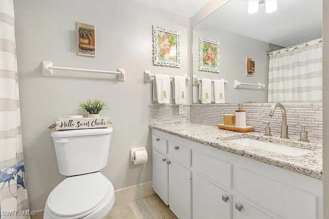 400 Lenell Rd Unit 207, Fort Myers Beach, FL 33931 - bathroom featuring backsplash, vanity, and wood finished floors