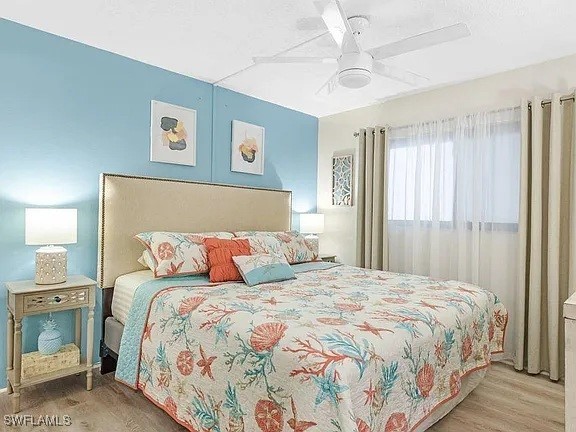 400 Lenell Rd Unit 207, Fort Myers Beach, FL 33931 - bedroom featuring wood finished floors and ceiling fan