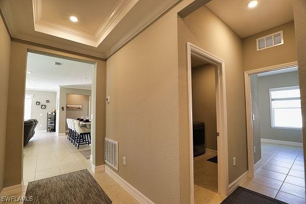 3393 Kacher Rd, North Port, FL 34288 - hall with crown molding, light tile patterned floors, and recessed lighting