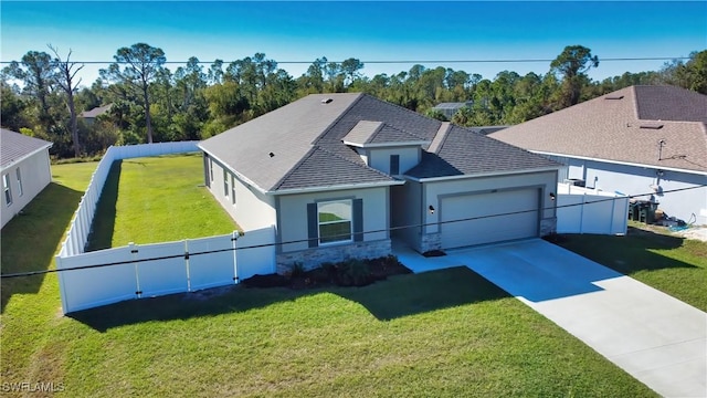 3393 Kacher Rd, North Port, FL 34288 - single story home with stucco siding, stone siding, an attached garage, driveway, and a shingled roof