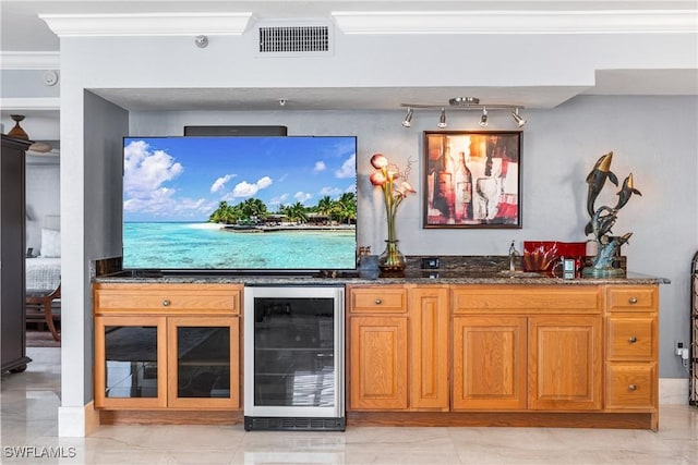 4745 Estero Blvd Unit 1002, Fort Myers Beach, FL 33931 - indoor wet bar featuring beverage cooler, ornamental molding, and light marble finish floors