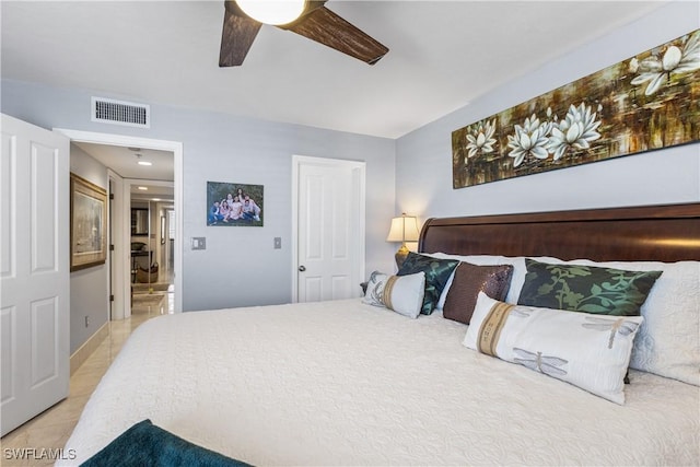 4745 Estero Blvd Unit 1002, Fort Myers Beach, FL 33931 - bedroom with a ceiling fan, light tile patterned floors, and ensuite bath