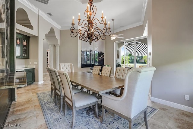 12850 Terabella Way, Fort Myers, FL 33912 - dining area featuring arched walkways, ornamental molding, ornate columns, a chandelier, and light tile patterned floors