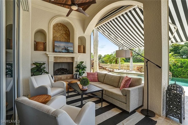 12850 Terabella Way, Fort Myers, FL 33912 - view of patio with an outdoor living space with a fireplace and a ceiling fan