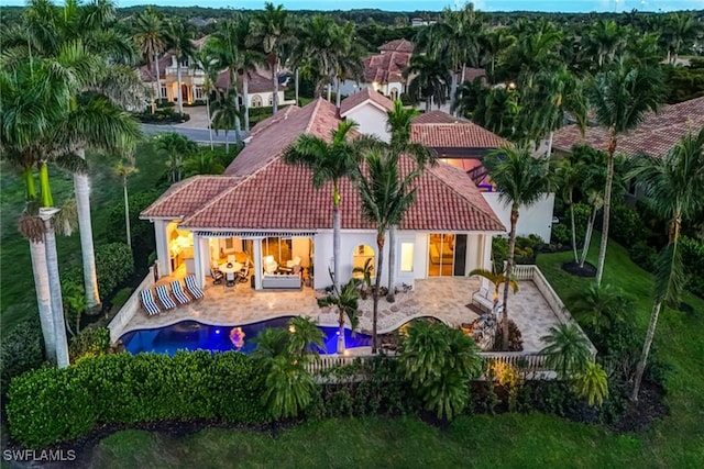 12850 Terabella Way, Fort Myers, FL 33912 - rear view of property featuring a tiled roof, a patio, and stucco siding