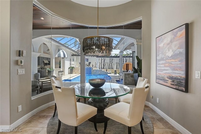 12850 Terabella Way, Fort Myers, FL 33912 - dining area with a chandelier, healthy amount of natural light, and tile patterned floors