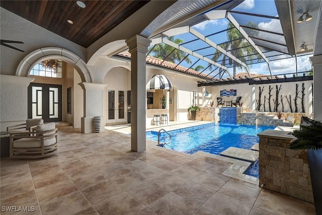 12850 Terabella Way, Fort Myers, FL 33912 - outdoor pool with french doors and a patio area