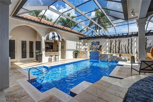 12850 Terabella Way, Fort Myers, FL 33912 - outdoor pool featuring french doors, a patio, and glass enclosure