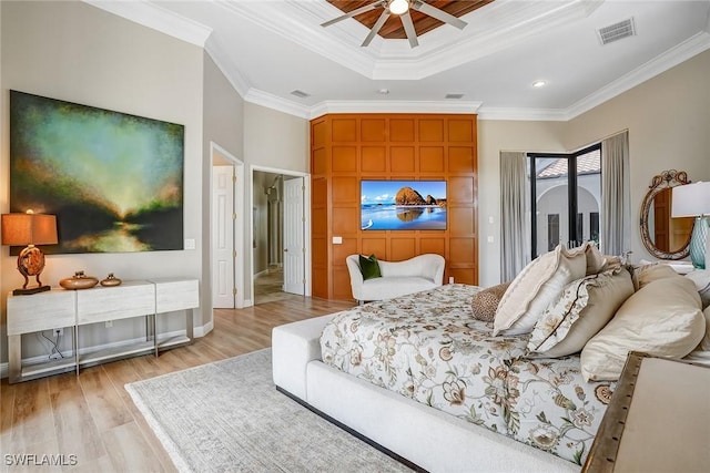 12850 Terabella Way, Fort Myers, FL 33912 - bedroom featuring a raised ceiling, light wood-style flooring, ornamental molding, access to exterior, and ceiling fan