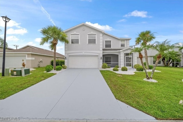 11544 Lake Cypress Loop, Fort Myers, FL 33913 - view of front facade featuring a garage, driveway, a front yard, and stucco siding
