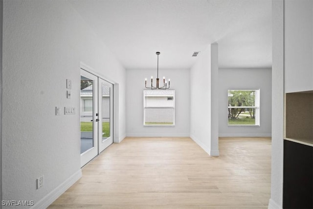 11544 Lake Cypress Loop, Fort Myers, FL 33913 - unfurnished dining area with a chandelier and light wood-style floors