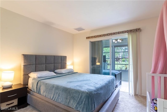 1014 Pine Isle Ln Unit 1014, Naples, FL 34112 - bedroom with light colored carpet and access to exterior